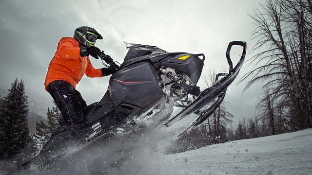 What is the best fit for clothing when snowmobiling?